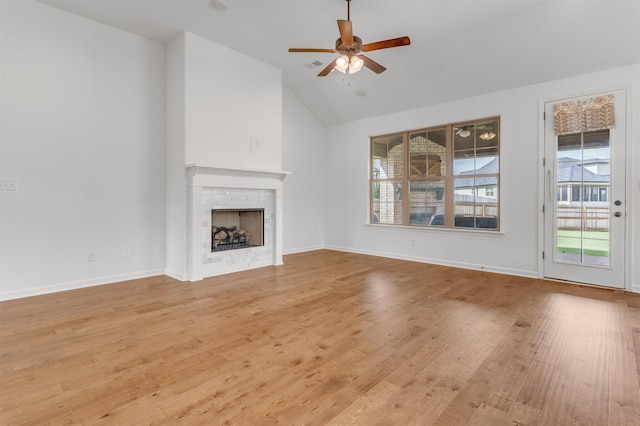 45 Laurel Hedge Cv, Oakland, TN 38060 - unfurnished living room with ceiling fan, light wood-style floors, a fireplace, baseboards, and high vaulted ceiling