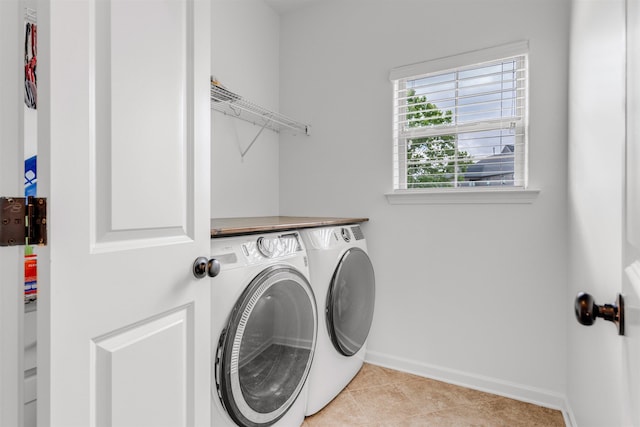 45 Laurel Hedge Cv, Oakland, TN 38060 - laundry room with independent washer and dryer, baseboards, and light tile patterned floors
