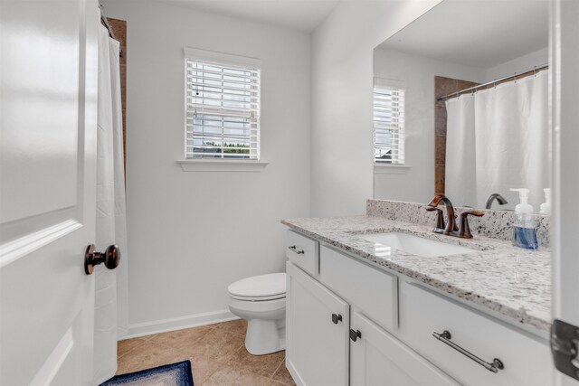 45 Laurel Hedge Cv, Oakland, TN 38060 - full bath featuring vanity, toilet, tile patterned flooring, baseboards, and curtained shower