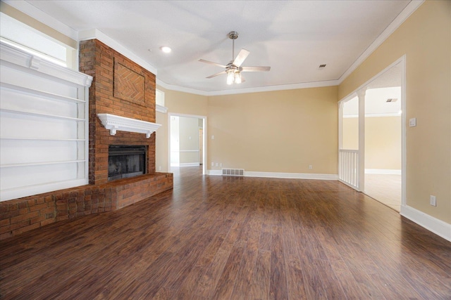 4386 S Germantown Rd, Memphis, TN 38125 - unfurnished living room featuring ceiling fan, dark wood finished floors, a fireplace, baseboards, and ornamental molding