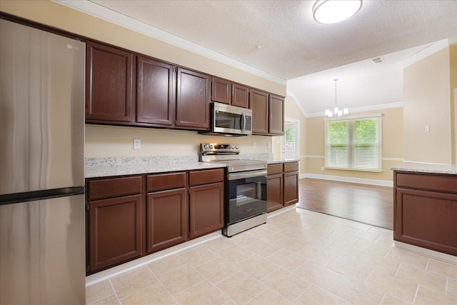 4386 S Germantown Rd, Memphis, TN 38125 - kitchen featuring appliances with stainless steel finishes, a chandelier, crown molding, dark brown cabinets, and light stone countertops
