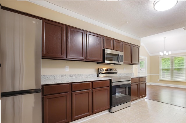 4386 S Germantown Rd, Memphis, TN 38125 - kitchen featuring appliances with stainless steel finishes, vaulted ceiling, a chandelier, dark brown cabinetry, and a textured ceiling