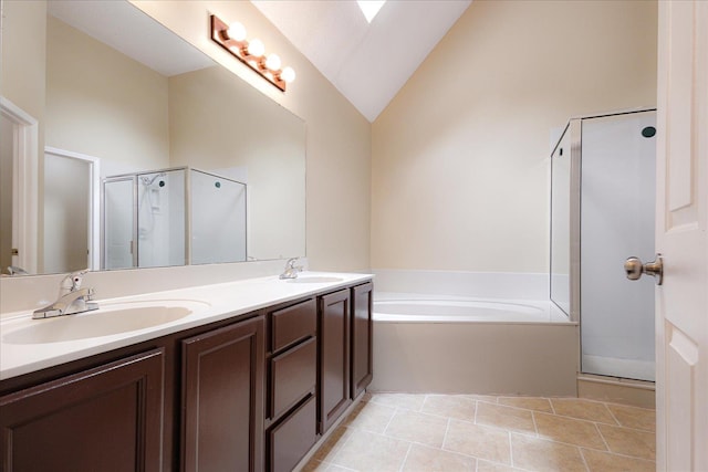 4386 S Germantown Rd, Memphis, TN 38125 - bathroom with a stall shower, vaulted ceiling, double vanity, a garden tub, and tile patterned floors