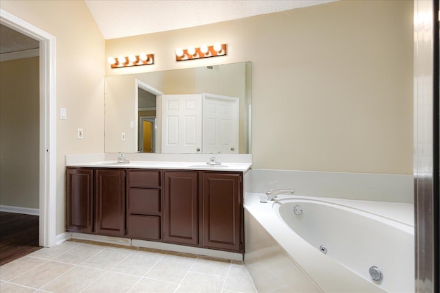 4386 S Germantown Rd, Memphis, TN 38125 - bathroom featuring a whirlpool tub, double vanity, and tile patterned floors