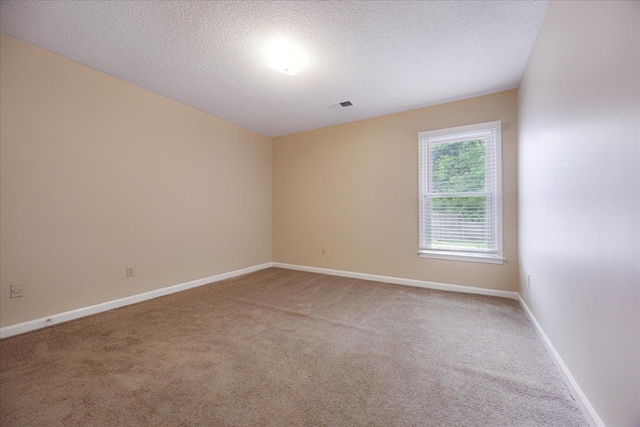 4386 S Germantown Rd, Memphis, TN 38125 - spare room with carpet floors, a textured ceiling, and baseboards