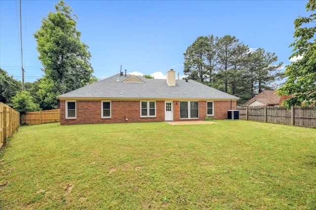 4386 S Germantown Rd, Memphis, TN 38125 - rear view of property with a chimney, brick siding, central AC, and a shingled roof
