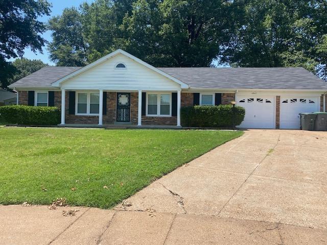 4947 Demeter Cv, Memphis, TN 38118 - ranch-style house featuring an attached garage, a front lawn, concrete driveway, a porch, and brick siding