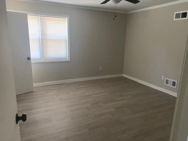 4947 Demeter Cv, Memphis, TN 38118 - spare room featuring ornamental molding, ceiling fan, wood finished floors, and baseboards