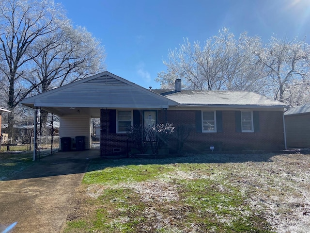 1770 Dorrie Ln, Memphis, TN 38117 - view of front of house with driveway, brick siding, and a carport