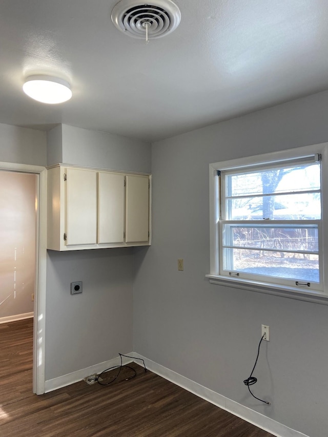 1770 Dorrie Ln, Memphis, TN 38117 - laundry area with cabinet space, baseboards, dark wood-type flooring, and hookup for an electric dryer