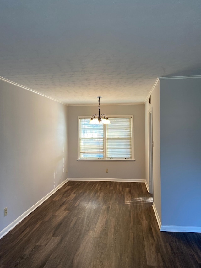 1770 Dorrie Ln, Memphis, TN 38117 - empty room featuring a chandelier, ornamental molding, dark wood-style flooring, and baseboards