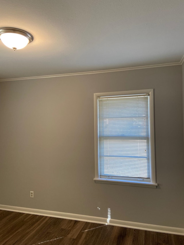 1770 Dorrie Ln, Memphis, TN 38117 - spare room with baseboards, dark wood-style flooring, and crown molding