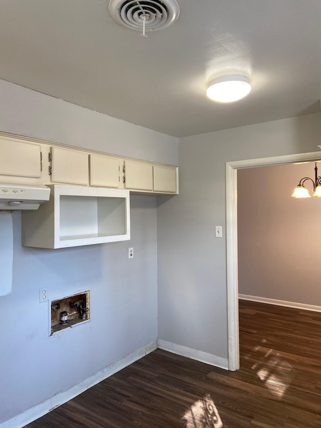 1770 Dorrie Ln, Memphis, TN 38117 - washroom with dark wood-style floors, baseboards, a chandelier, and washer hookup