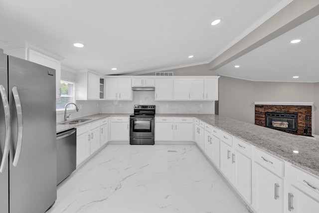 229 Coats Rd, Brighton, TN 38011 - kitchen with stainless steel appliances, a sink, ornamental molding, light stone countertops, and under cabinet range hood
