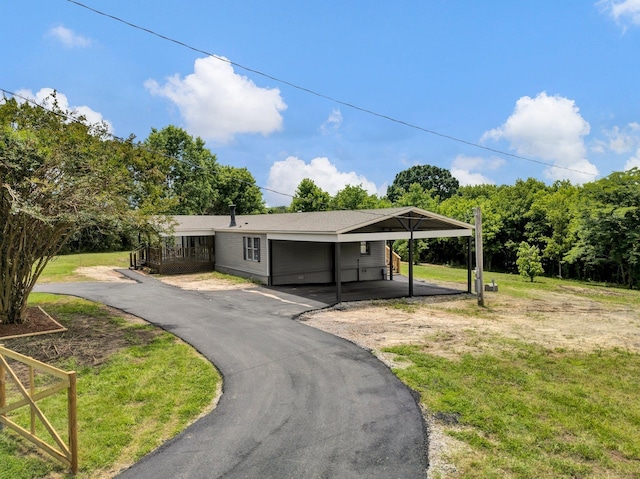 229 Coats Rd, Brighton, TN 38011 - ranch-style house featuring a front lawn, asphalt driveway, and an attached garage
