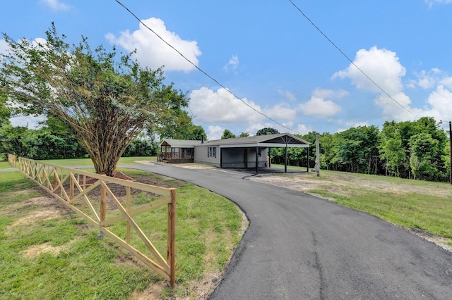 229 Coats Rd, Brighton, TN 38011 - view of front of property with asphalt driveway, a front yard, and a carport