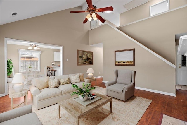 9270 Durhamshire Dr, Cordova, TN 38016 - living room with ceiling fan, wood finished floors, baseboards, high vaulted ceiling, and a chandelier