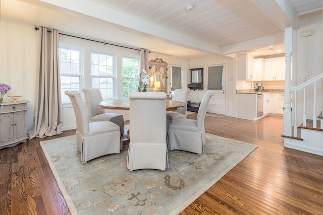 241 Greenway Rd, Memphis, TN 38117 - dining space featuring beam ceiling, wood finished floors, and stairs