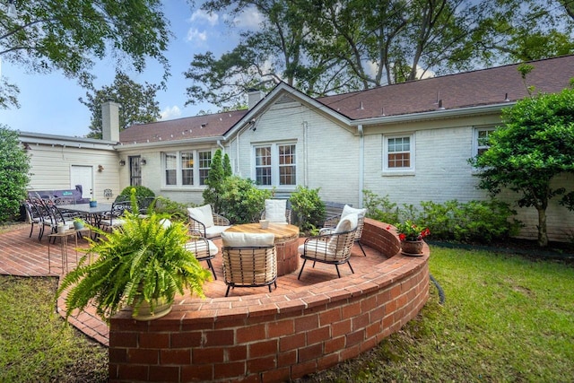 241 Greenway Rd, Memphis, TN 38117 - back of property with a chimney, brick siding, a yard, a patio area, and outdoor dining area