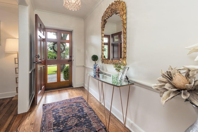 241 Greenway Rd, Memphis, TN 38117 - foyer entrance with ornamental molding, a chandelier, wood finished floors, and baseboards
