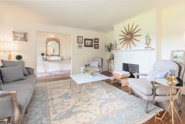 241 Greenway Rd, Memphis, TN 38117 - living area featuring wood finished floors, a fireplace with raised hearth, and ornamental molding