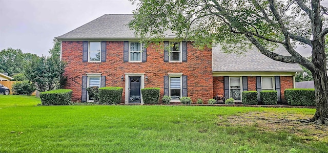 1105 Winrose Dr, Collierville, TN 38017 - colonial home featuring a front yard, roof with shingles, and brick siding