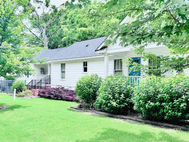 1742 Nelson Ave, Memphis, TN 38114 - back of property with a shingled roof and a yard