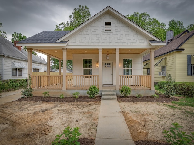1742 Nelson Ave, Memphis, TN 38114 - view of front facade featuring a porch, a shingled roof, and cooling unit