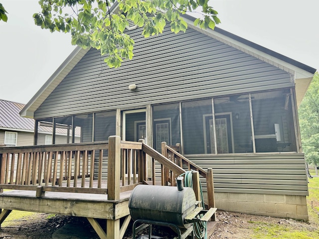 20 Betty Blvd, Iuka, MS 38852 - rear view of property featuring a sunroom and a wooden deck