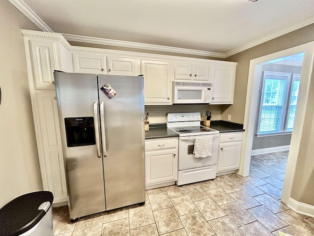 20 Betty Blvd, Iuka, MS 38852 - kitchen with white appliances, dark countertops, ornamental molding, white cabinetry, and baseboards