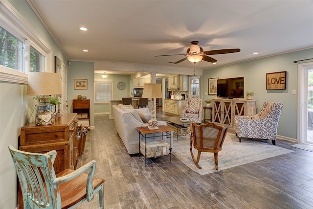 1611 Ivy Rd, Memphis, TN 38117 - living area with dark wood finished floors, recessed lighting, a ceiling fan, crown molding, and baseboards