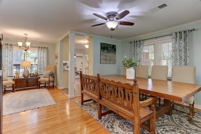 1611 Ivy Rd, Memphis, TN 38117 - dining area with ceiling fan, ornamental molding, light wood-type flooring, and a chandelier