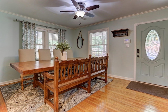 1611 Ivy Rd, Memphis, TN 38117 - dining space featuring a ceiling fan, wood finished floors, ornamental molding, and baseboards