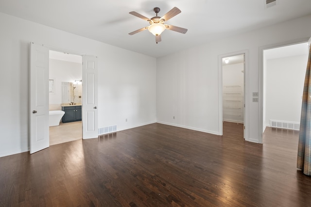 2073 W Houston Way, Collierville, TN 38139 - unfurnished bedroom with wood finished floors, connected bathroom, baseboards, and ceiling fan
