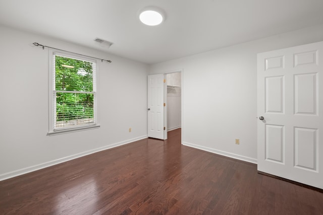 2073 W Houston Way, Collierville, TN 38139 - unfurnished bedroom featuring dark wood finished floors, baseboards, and a spacious closet