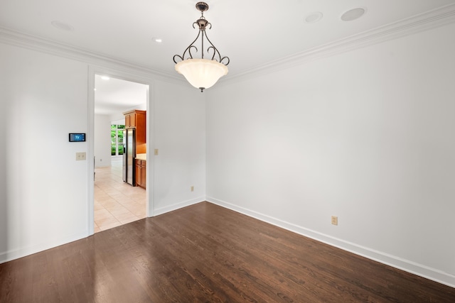 2073 W Houston Way, Collierville, TN 38139 - spare room featuring crown molding, light wood-style flooring, and baseboards