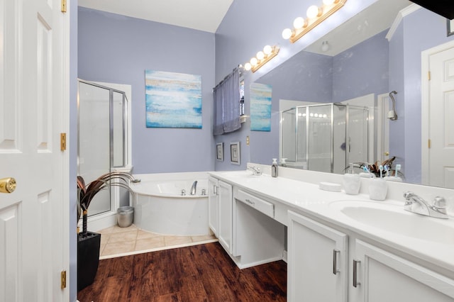 4528 Queen Sinclair Cir, Millington, TN 38053 - full bathroom with a shower stall, double vanity, a garden tub, and wood finished floors