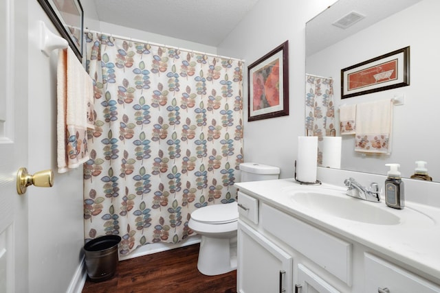 4528 Queen Sinclair Cir, Millington, TN 38053 - bathroom featuring vanity, wood finished floors, toilet, and a shower with shower curtain