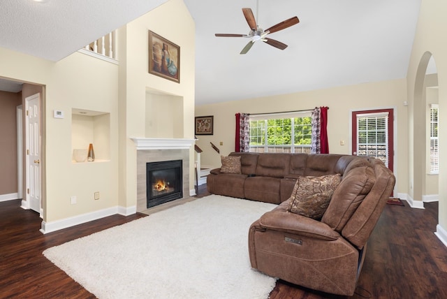 4528 Queen Sinclair Cir, Millington, TN 38053 - living area with a ceiling fan, wood finished floors, high vaulted ceiling, a tiled fireplace, and baseboards