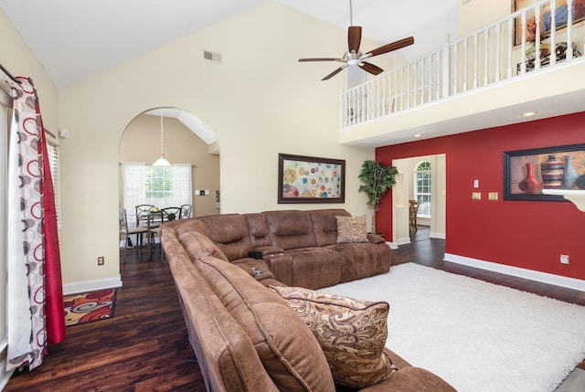 4528 Queen Sinclair Cir, Millington, TN 38053 - living room with arched walkways, wood finished floors, healthy amount of natural light, a ceiling fan, and high vaulted ceiling