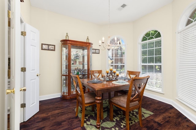 4528 Queen Sinclair Cir, Millington, TN 38053 - dining area with a chandelier, dark wood-style flooring, and baseboards