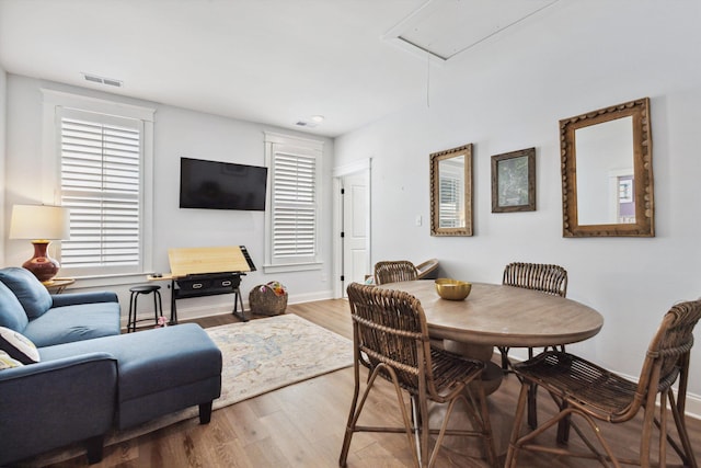 386 Ellsworth St, Memphis, TN 38111 - dining room featuring attic access, wood finished floors, and baseboards