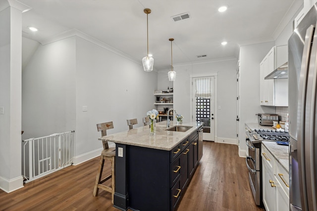 386 Ellsworth St, Memphis, TN 38111 - kitchen featuring a sink, stainless steel appliances, dark wood finished floors, white cabinetry, and recessed lighting