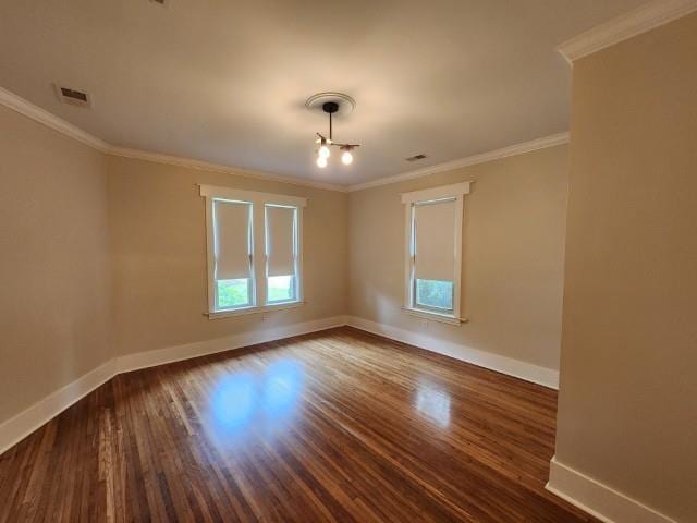 1466 Snowden Ave, Memphis, TN 38107 - unfurnished room featuring baseboards, dark wood-type flooring, and crown molding