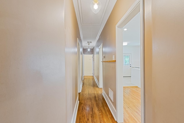 1466 Snowden Ave, Memphis, TN 38107 - hall featuring attic access, wood finished floors, crown molding, and baseboards