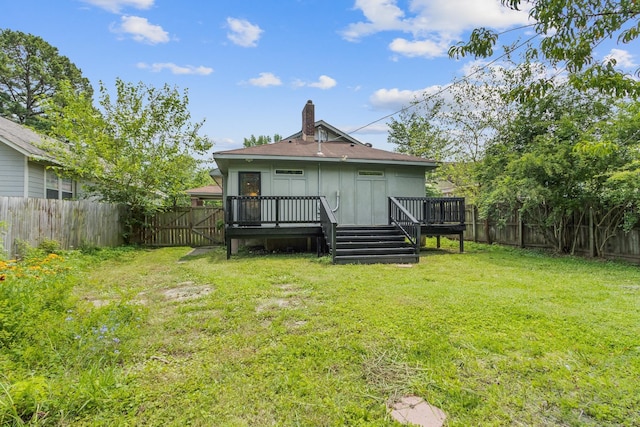 1466 Snowden Ave, Memphis, TN 38107 - back of house featuring a chimney and a wooden deck