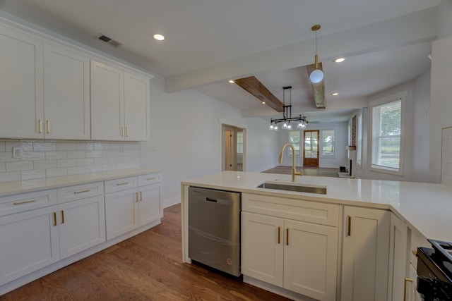 857 E Parkway St, Memphis, TN 38104 - kitchen featuring stainless steel dishwasher, a sink, black range oven, tasteful backsplash, and beam ceiling