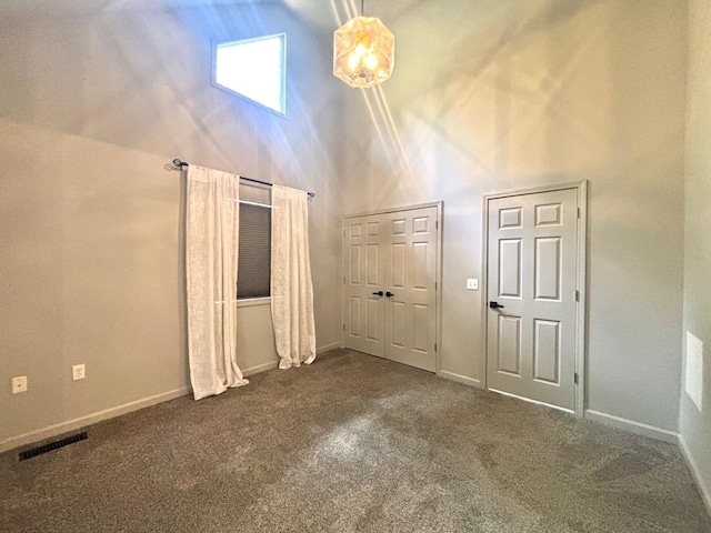 245 Holiday Hills Ln, Counce, TN 38326 - foyer featuring a high ceiling, carpet, and baseboards