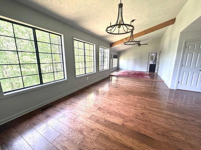 245 Holiday Hills Ln, Counce, TN 38326 - unfurnished living room with wood finished floors, a chandelier, a textured ceiling, and baseboards