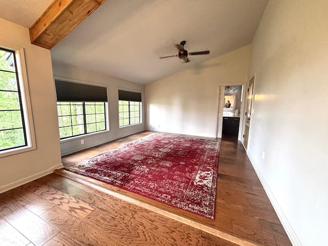 245 Holiday Hills Ln, Counce, TN 38326 - unfurnished room featuring vaulted ceiling, a ceiling fan, baseboards, and wood finished floors